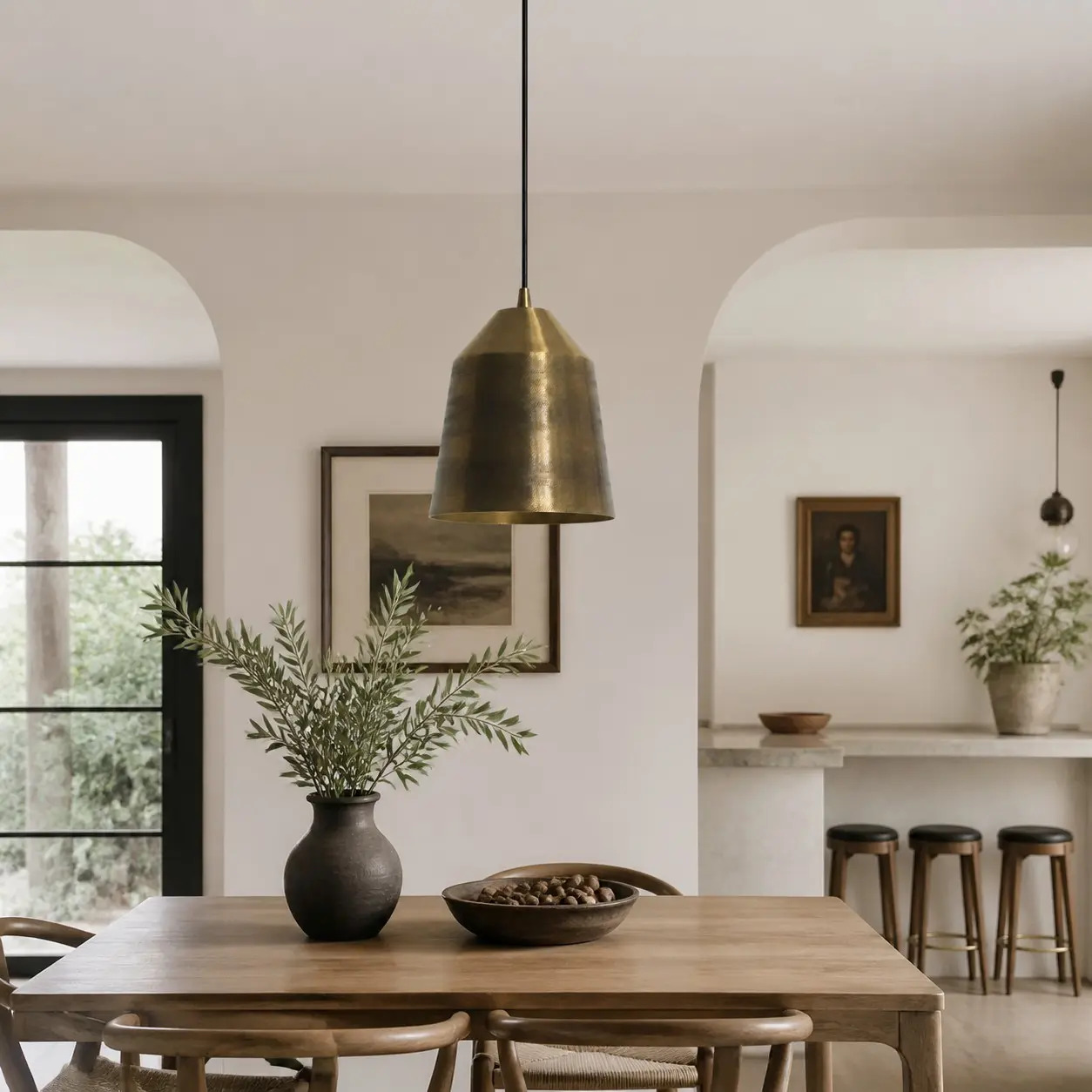 Brass pendant lamp installed above a dining space