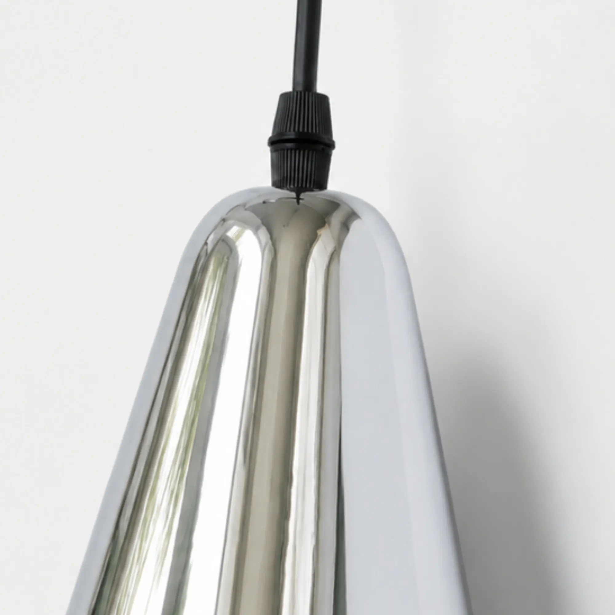 Polished chrome shade edge and cord entry detail